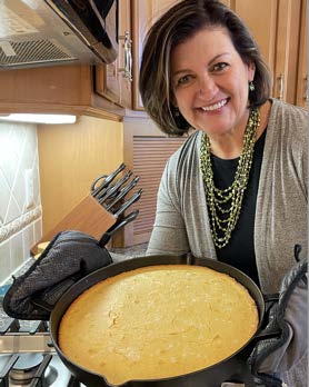 Dr. Pando displaying her brown butter skillet cornbread