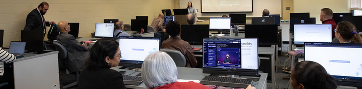 faculty working in computer classroom room during professional development session