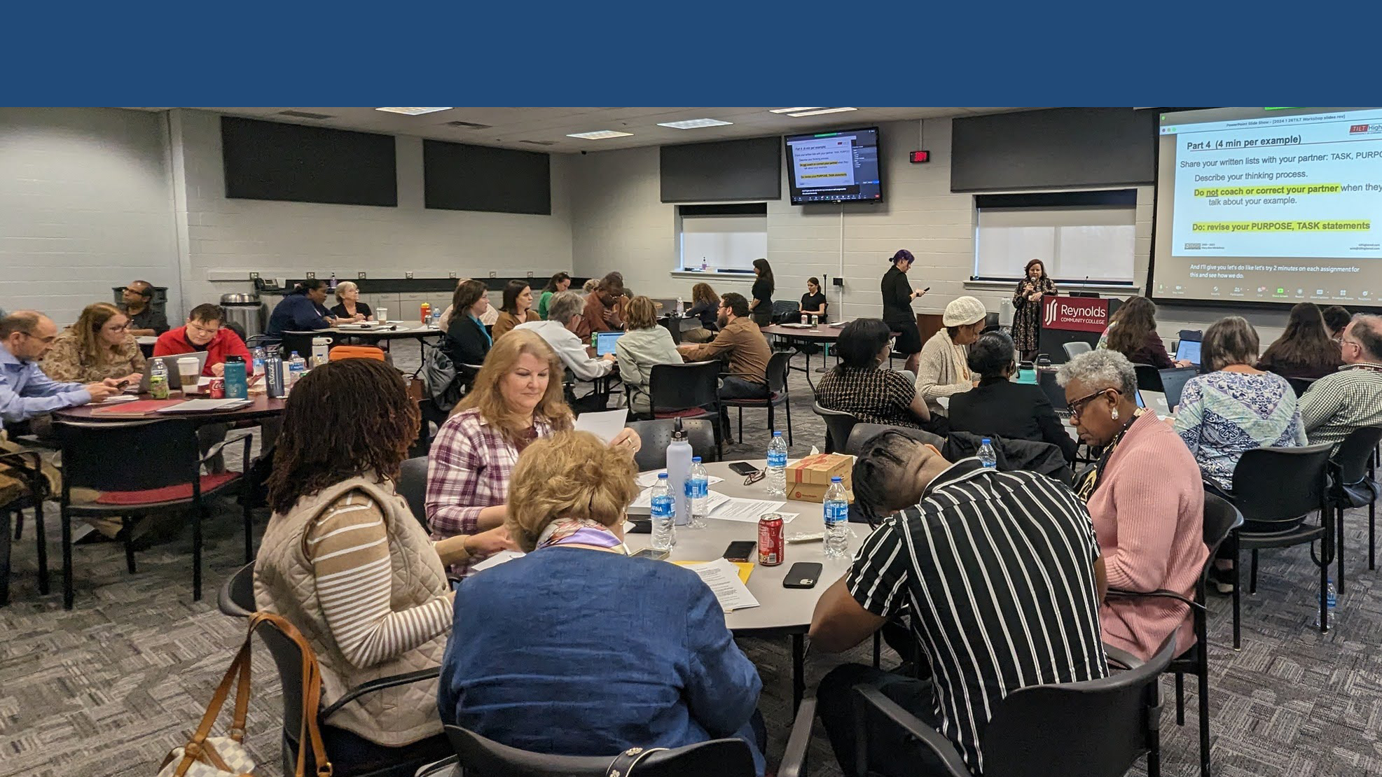 Faculty sitting together at a round table