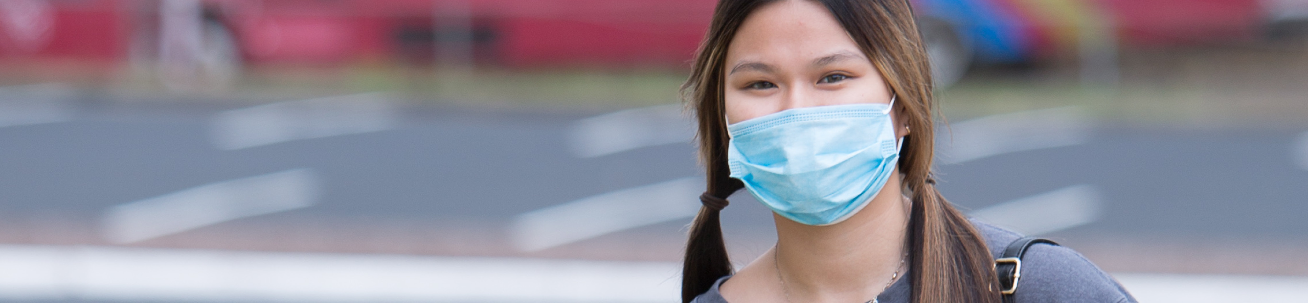 Student with mask on campus