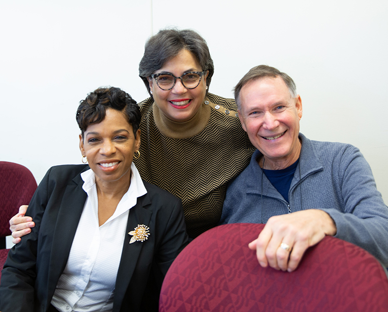 Judge Tanya Battle, Instructor Delta Bowers, and Judge Mike Lewandowski smile at the camera.