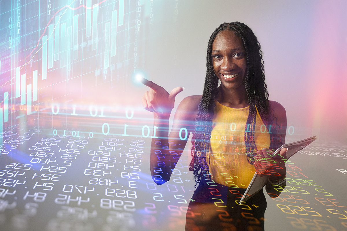 Thin black woman with long braids touches clear data screen in front of her illuminating finger