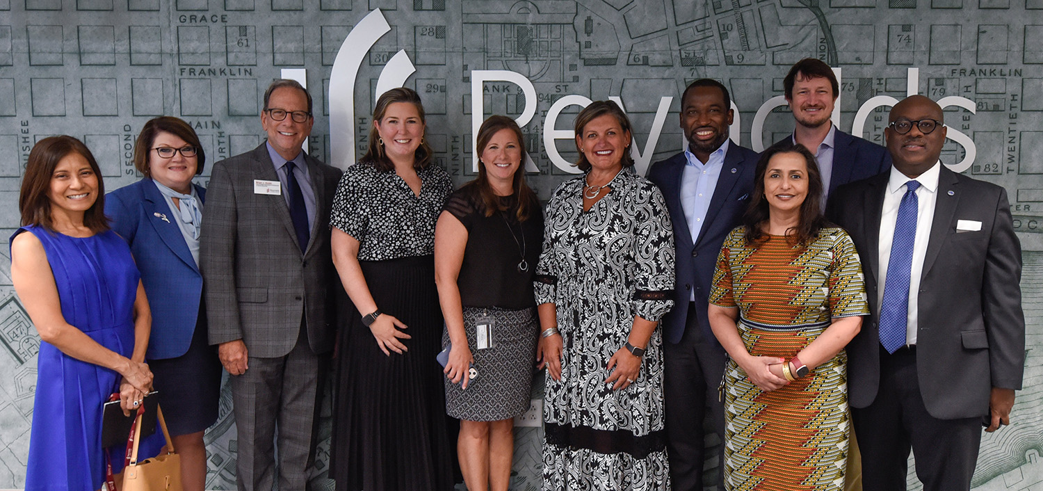 Group shot of Dr. Paula Pando with City of Richmond Mayor Stoney along with others in partnership of Reynolds and the City of Richmond