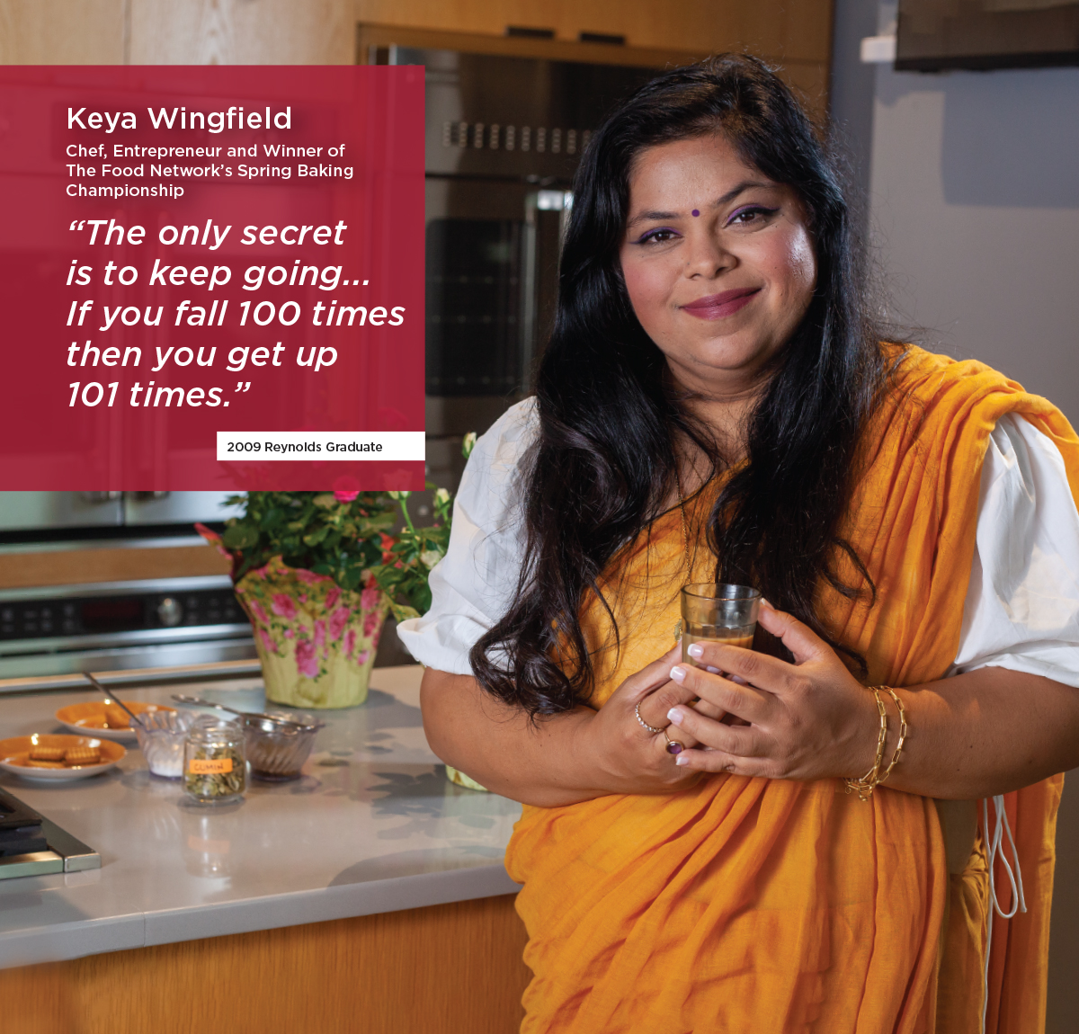 Indian woman, Keya Wingfield poses in Indian dress in industrial kitchen