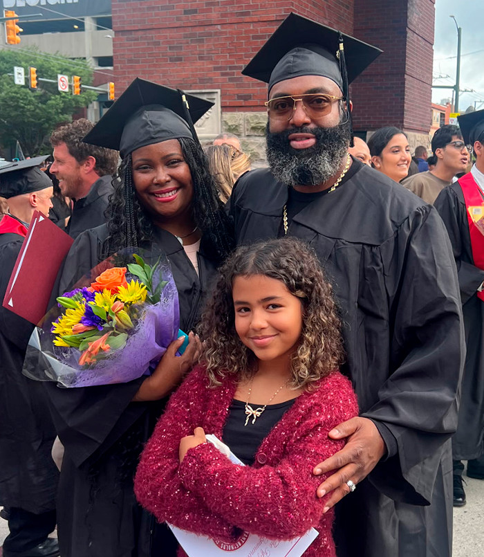 Dominique and William McLane, along with their daughter, on graduation day.