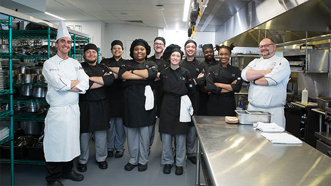 Culinary students pictured with Chef Savilisky and Chef Miller at The Kitchens at Reynolds.