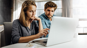 Two people looking at a computer screen